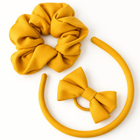 Yellow school hair accessories set by Pieter Lategan Studio, featuring a matching Alice band, scrunchie and hair bow.